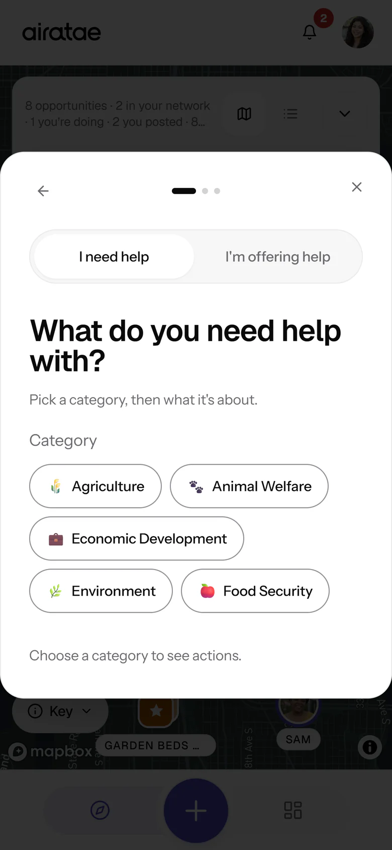 The Create sheet over the map, asking “What do you need help with?”, with a switch between I need help, selected, and I’m offering help, the five categories Agriculture, Animal Welfare, Economic Development, Environment and Food Security, and the hint Choose a category to see actions.